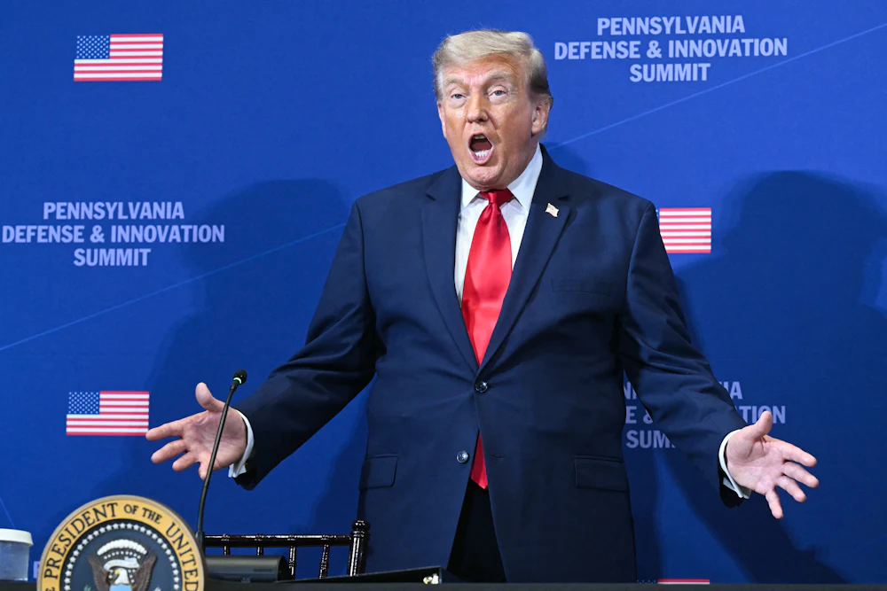 Donald Trump gestures as he arrives to speak at the Pennsylvania Defense and Innovation Summit.