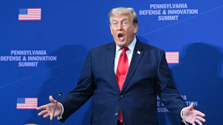 Donald Trump gestures as he arrives to speak at the Pennsylvania Defense and Innovation Summit.