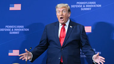 Donald Trump gestures as he arrives to speak at the Pennsylvania Defense and Innovation Summit.
