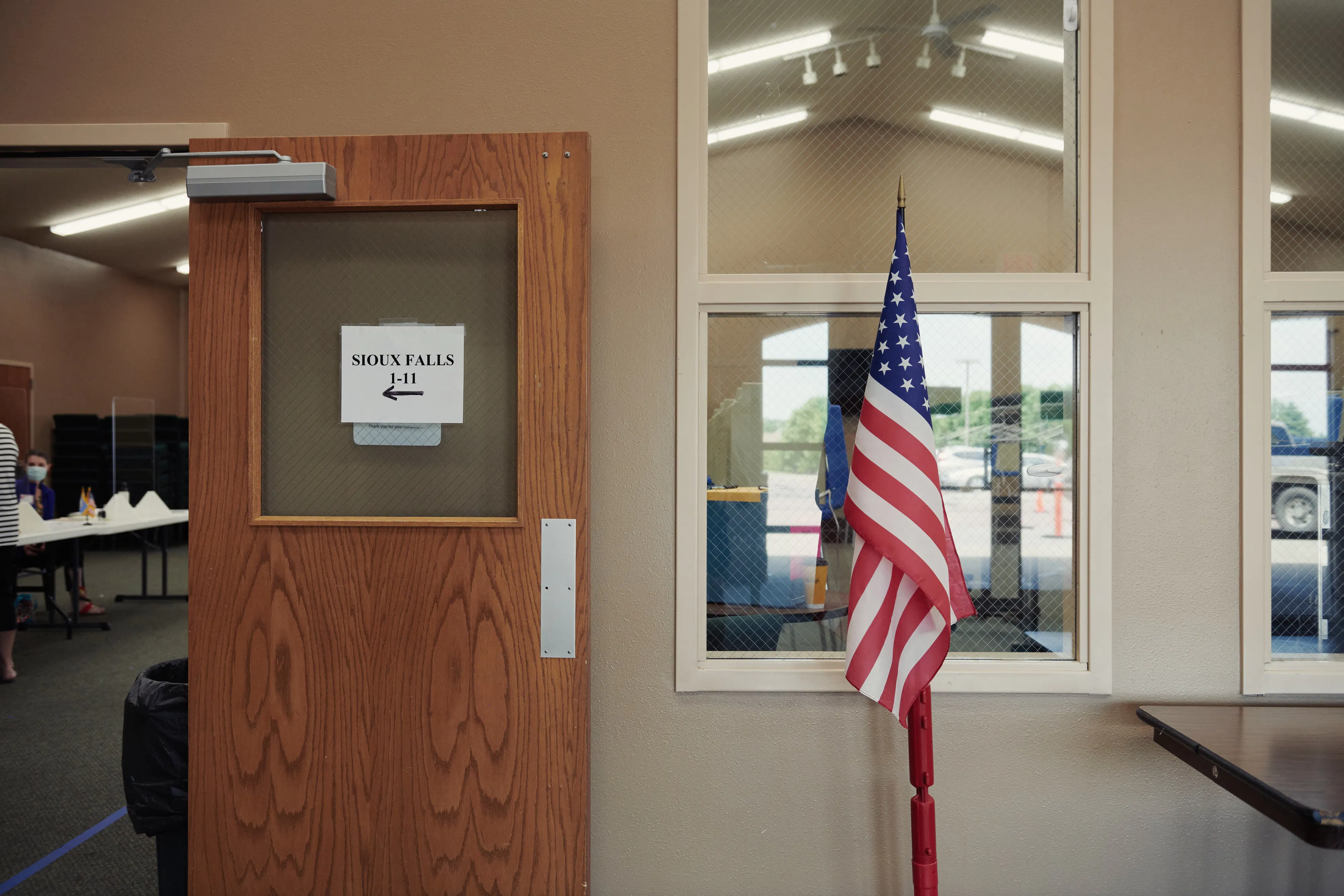 An American flag stands on display at a polling location in Sioux Falls, South Dakota.
