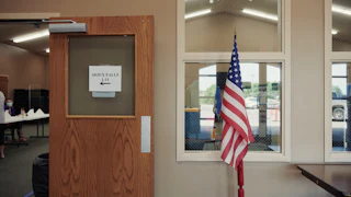 An American flag stands on display at a polling location in Sioux Falls, South Dakota.