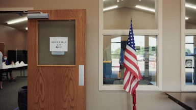 An American flag stands on display at a polling location in Sioux Falls, South Dakota.