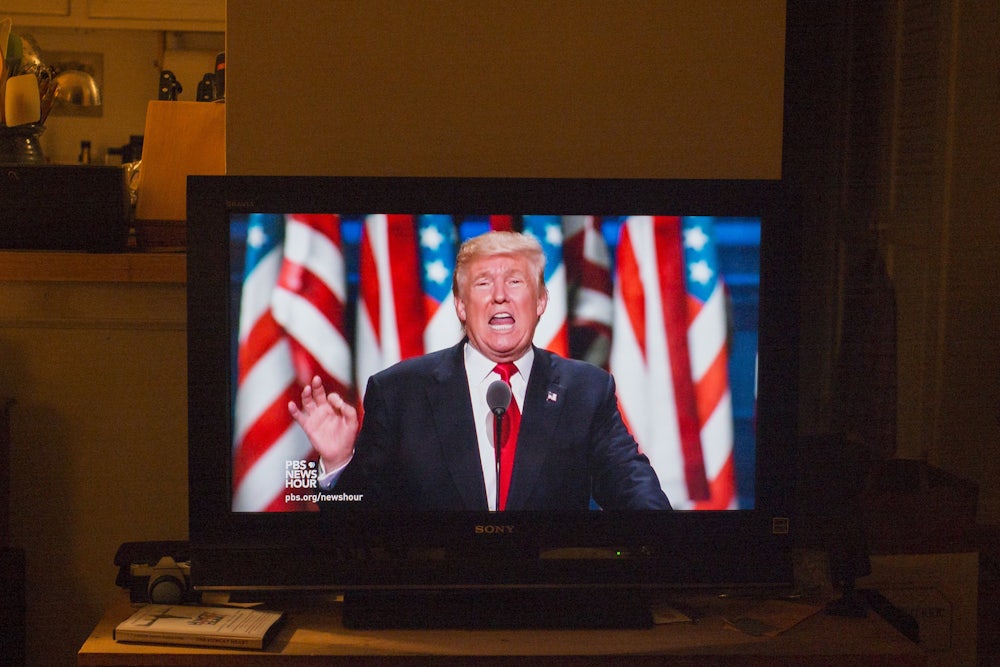 Republican presidential candidate Donald Trump delivers a speech during the evening session on the fourth day of the Republican National Convention on July 21, 2016 at the Quicken Loans Arena in Cleveland, Ohio as shown on a television screen.