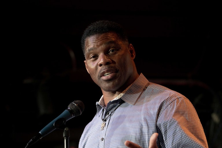 Herschel Walker speaks at a standing mic