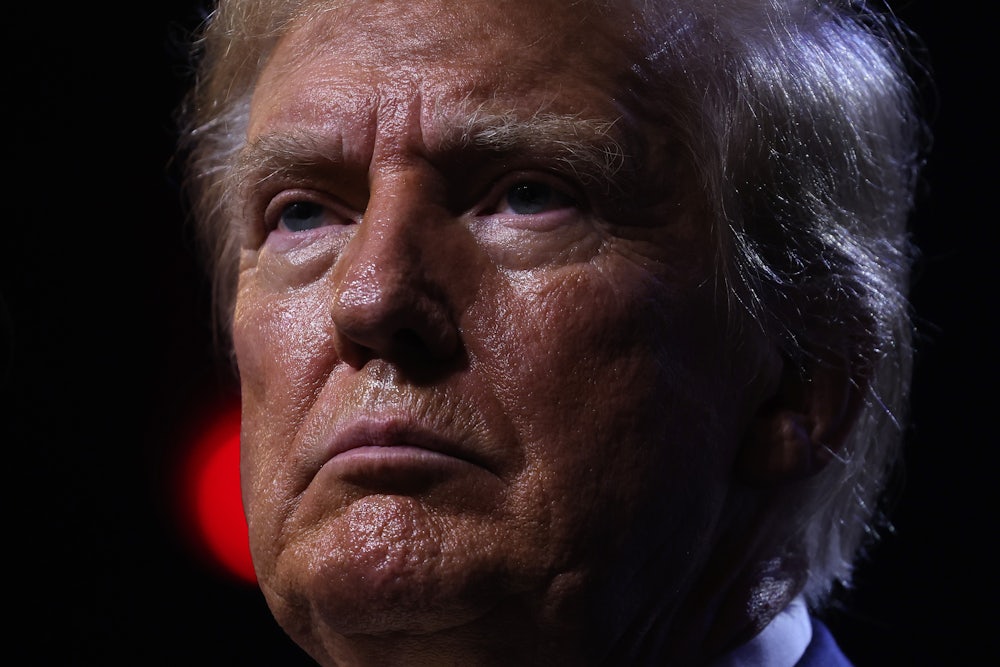Donald Trump is seen close up, scowling in anger