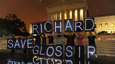 Anti-death penalty activists rally outside the U.S. Supreme Court on behalf of Oklahoma death row inmate Richard Glossip.