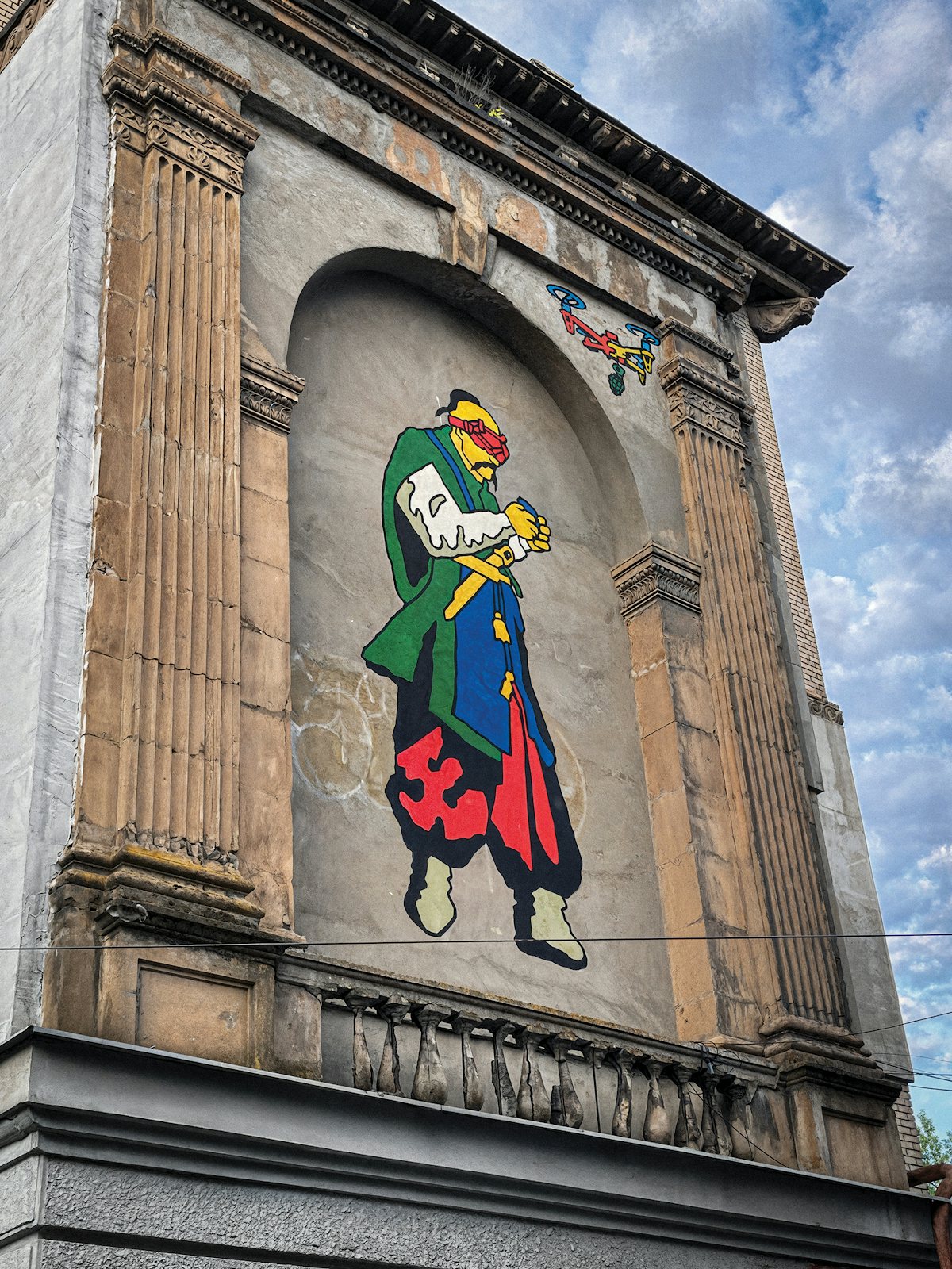 A photo of a mural in Zaporizhzhia, Ukraine, depicts a Cossack flying a drone.