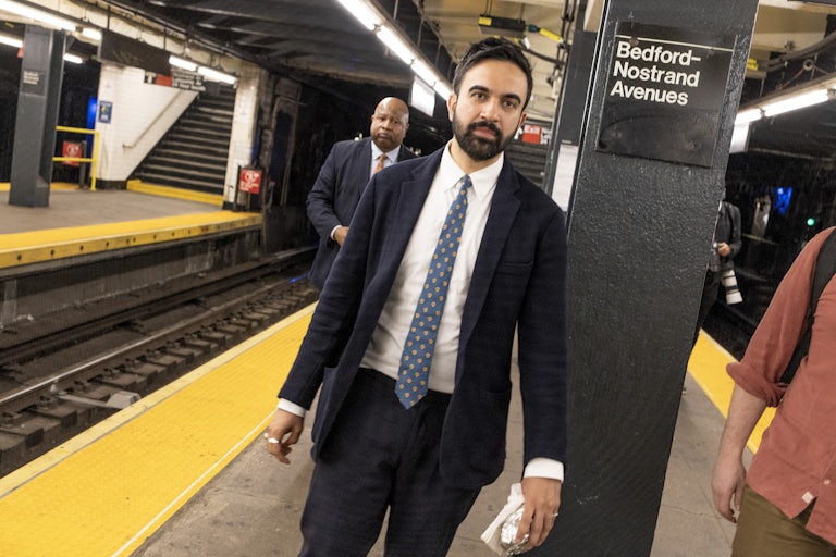 Zohran Mamdani walking in the New York City subway. He's at the Stop Bedford-Nostrand Avenues.