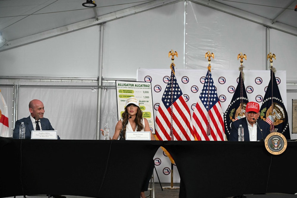 Homeland security secretary Kristi Noem, flanked by Donald Trump and White House deputy chief of staff Stephen Miller, spoke on July 1 during a roundtable discussion at a migrant detention center in Florida dubbed “Alligator Alcatraz.”