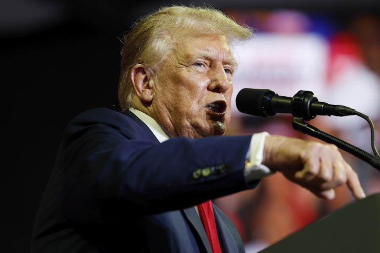Donald Trump speaks at a lectern