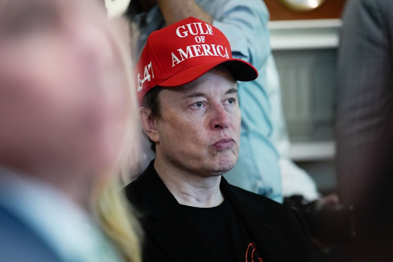 Elon Musk purses his lips while sitting in Donald Trump's Cabinet meeting