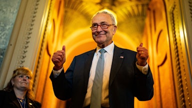 Senate Majority Leader Chuck Schumer flashed two thumbs up in celebration of the passage of the Inflation Reduction Act.