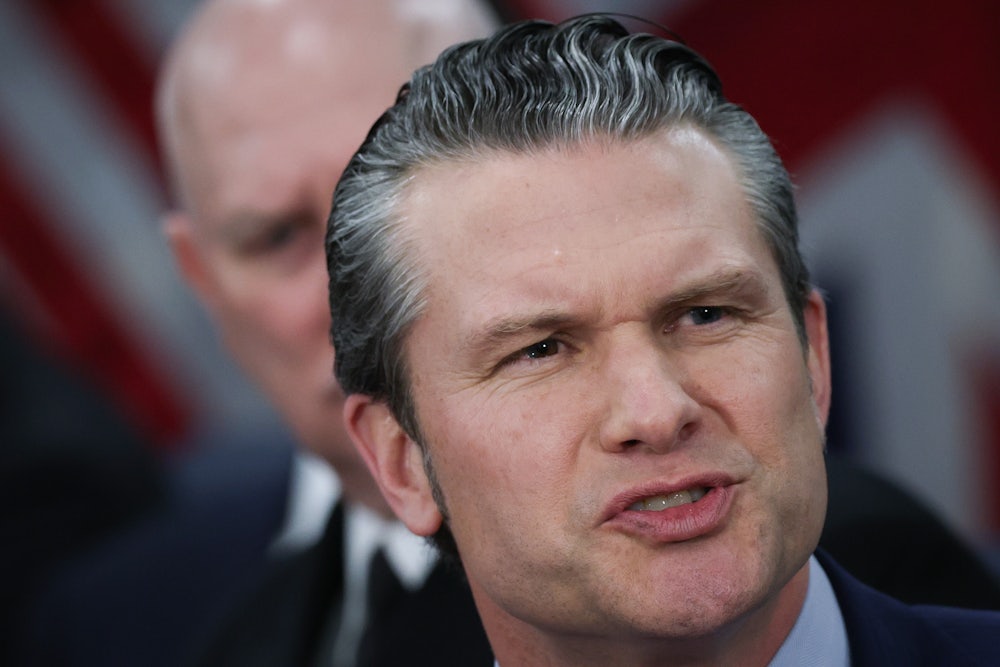 Defense Secretary Pete Hegseth frowns and speaks