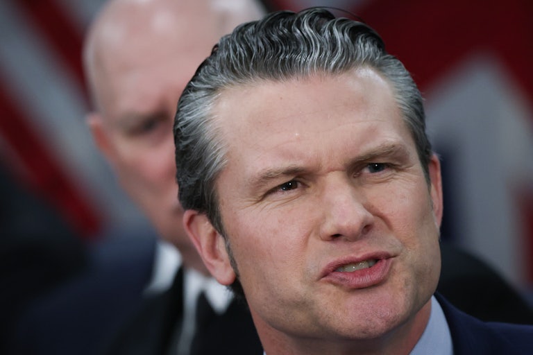 Defense Secretary Pete Hegseth frowns and speaks