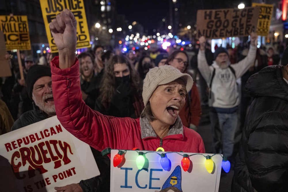 Demonstrators protest the Trump administration and ICE