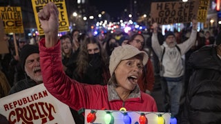 Demonstrators protest the Trump administration and ICE
