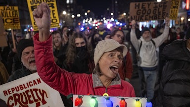 Demonstrators protest the Trump administration and ICE