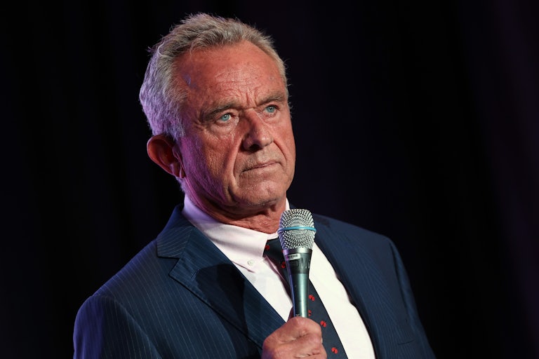 Robert F. Kennedy Jr. holds a mic