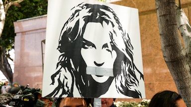 Activists supporting Britney Spears hold a sign aloft at a protest during the pop star's conservatorship hearing.
