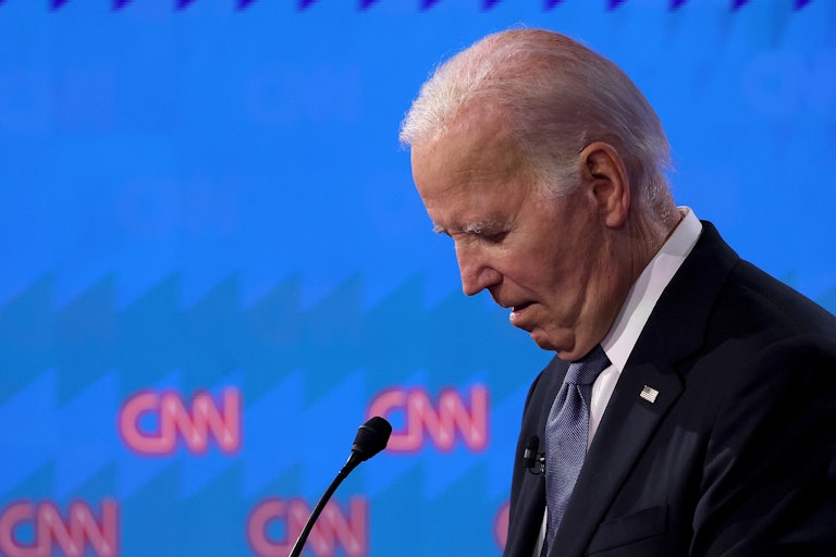 Joe Biden looks downward on the CNN debate stage