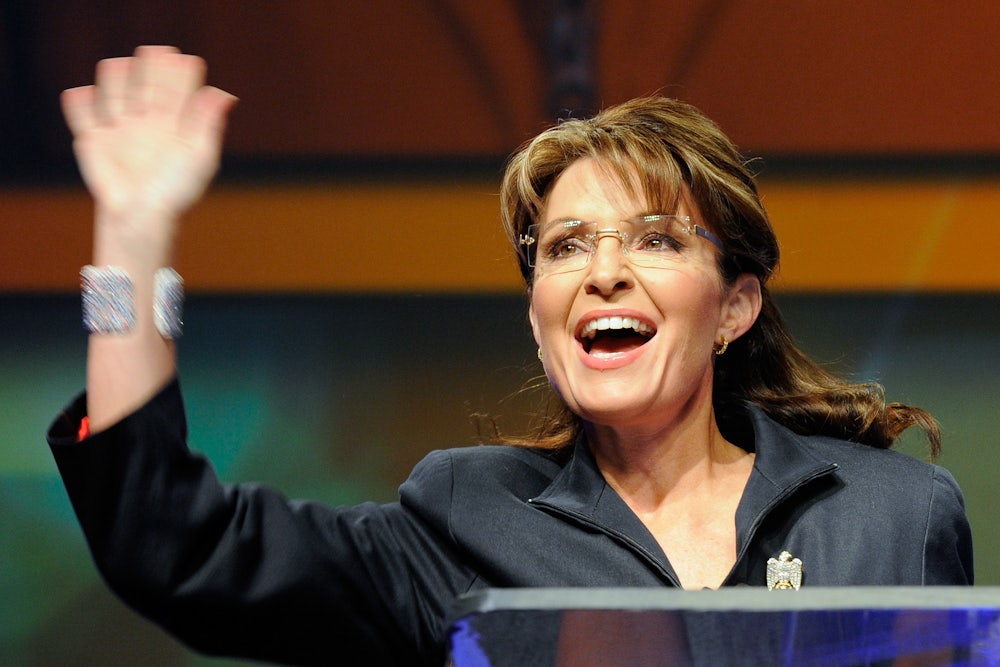 Sarah Palin waves.