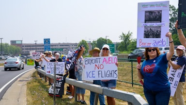 People protest against Avelo Airlines outside Albany International Airport in Albany, New York