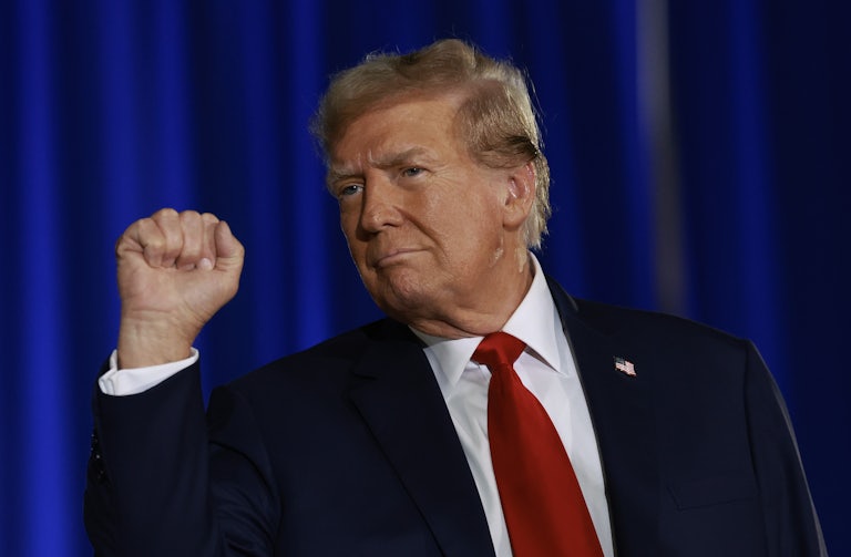 Donald Trump holds up his fist