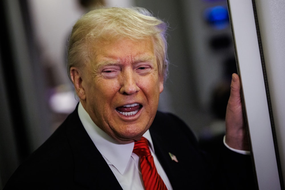 Trump speaks to reporters on plane