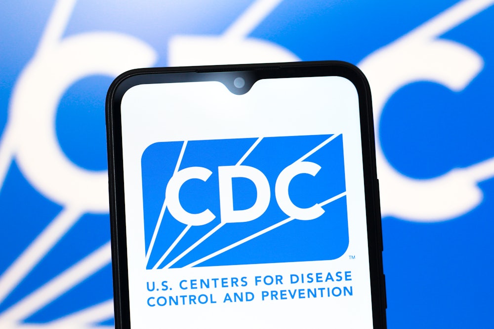 The Centers for Disease Control and Prevention (CDC) logo is seen displayed on a smartphone screen.