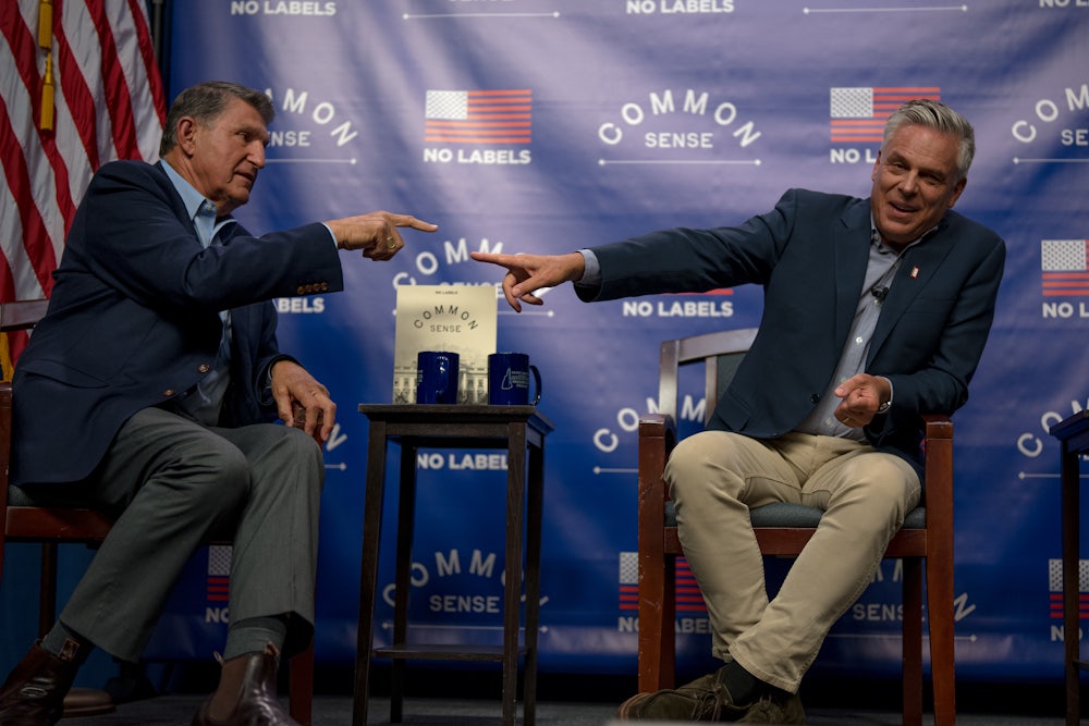 Joe Manchin and Jon Huntsman on a stage