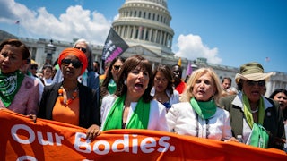 Democratic House members Ilhan Omar, Jackie Speier, Carolyn Maloney, and Alma Adams march toward the US Supreme Court during a July protest.