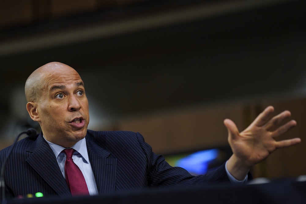 Senator Cory Booker gestures as he speaks at a hearing on Capitol Hill.