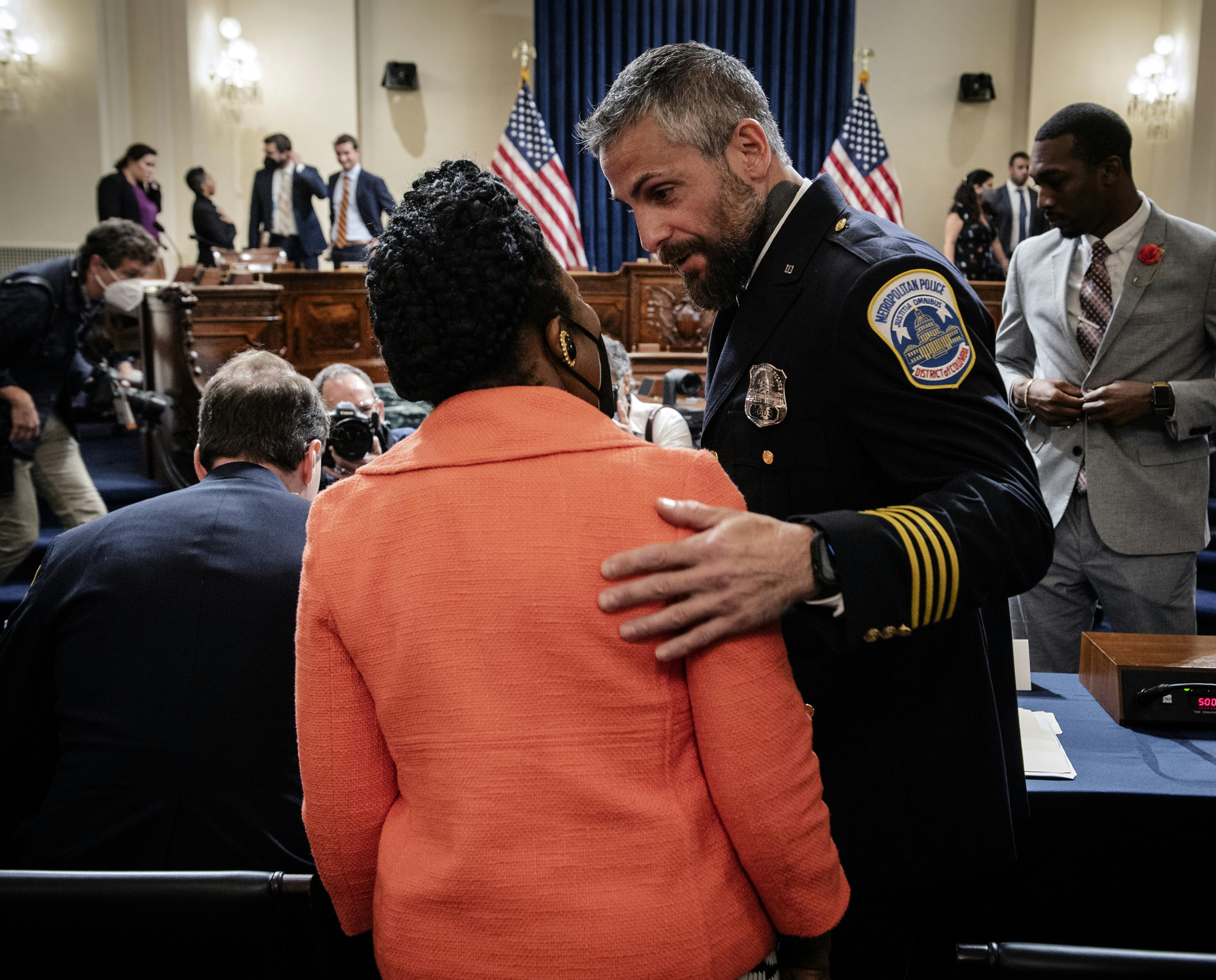 Officer Michael Fanone greets Representative Sheila Jackson-Lee during a hearing of the January 6th commission.