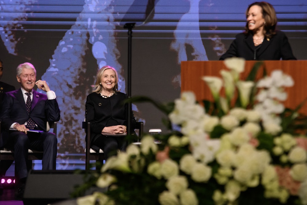 Bill and Hillary Clinton watch Kamala Harris speak.