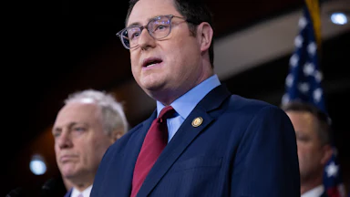 Representative Mike Flood speaks during a press conference
