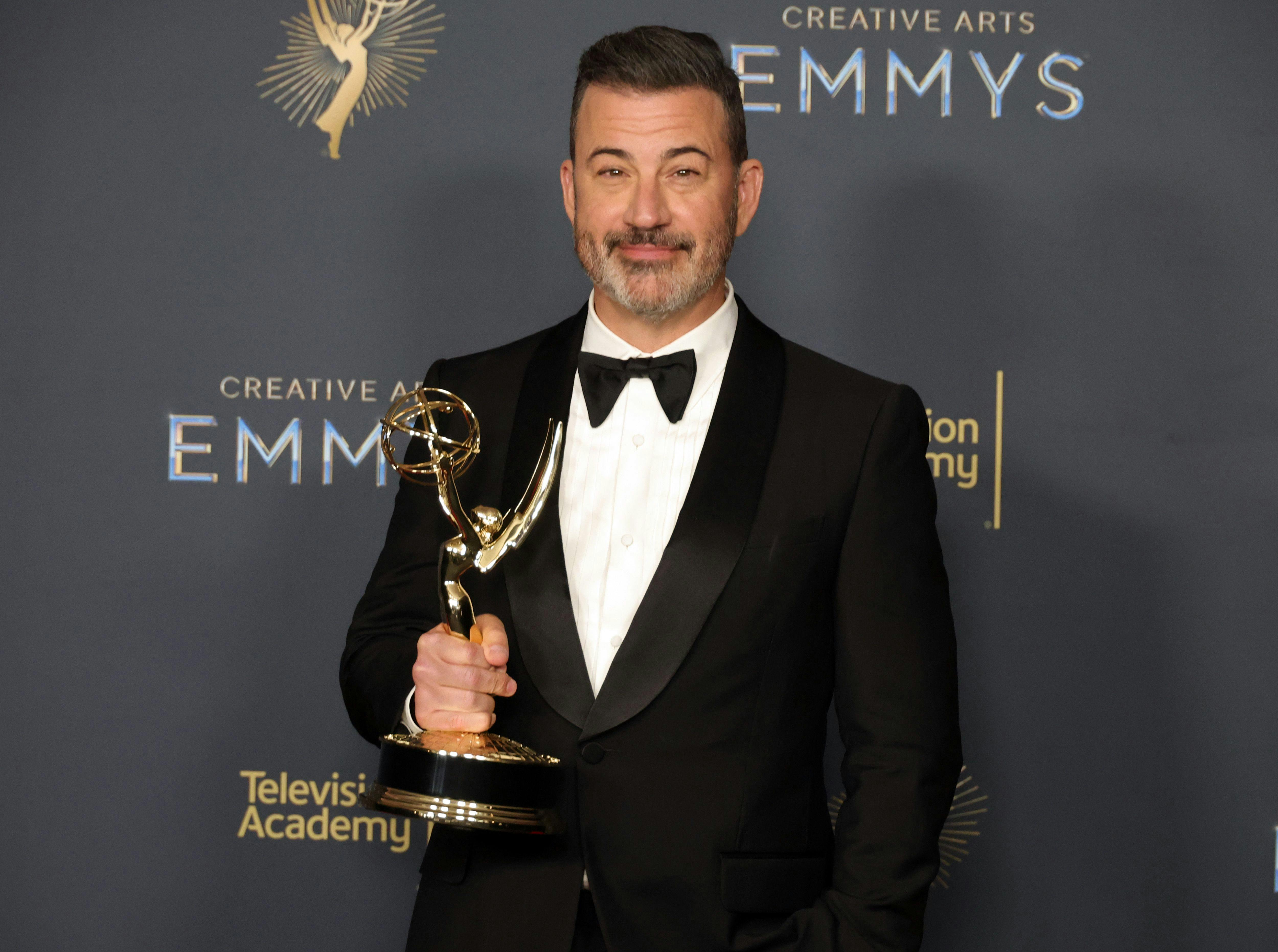 Jimmy Kimmel holds an Emmy