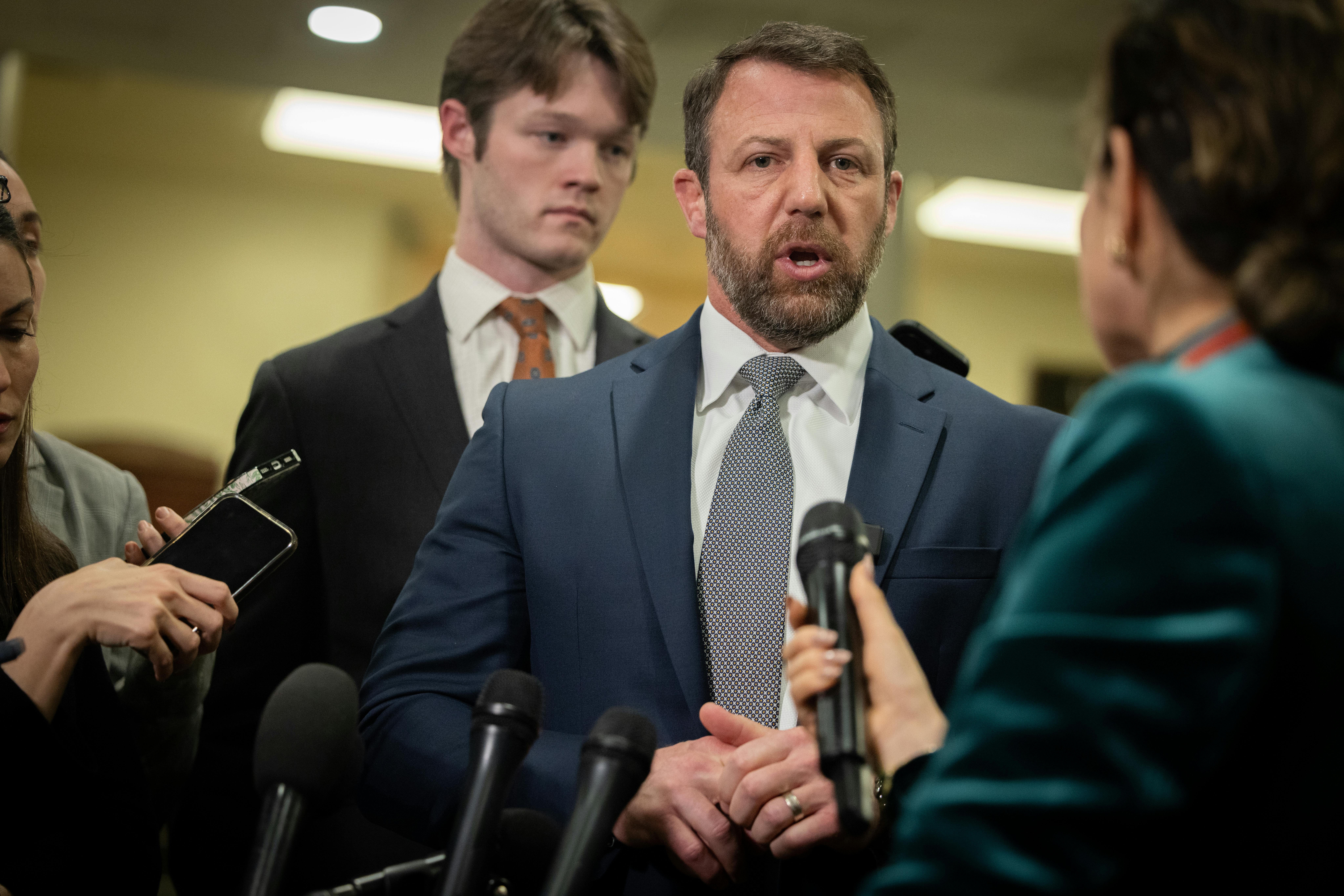 Senator Markwayne Mullin speaks to reporters.