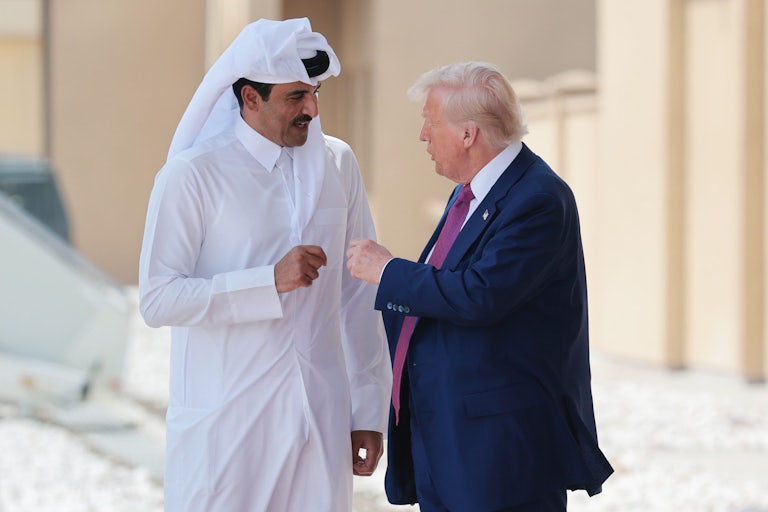 Donald Trump fistbumps and speaks with Emir of Qatar Tamim bin Hamad al Thani.