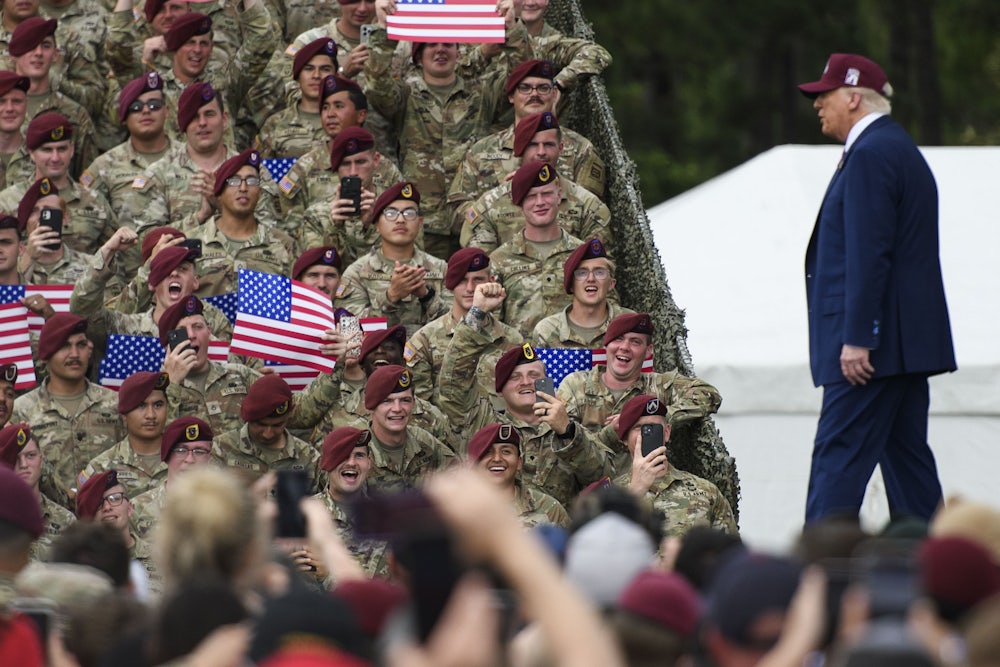 Soldiers react as U.S. President Donald Trump arrives on stage during a celebration to honor the 250th anniversary of the U.S. Army in Fort Bragg, North Carolina.