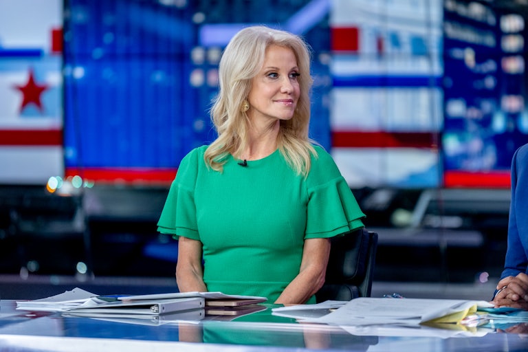 Kellyanne Conway sits at a pundits' table.