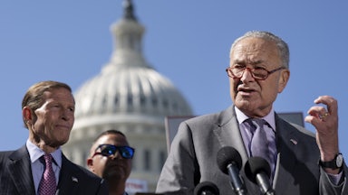 Chuck Schumer speaks at a podium.