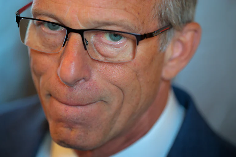 Senator John Thune presses his lips together
