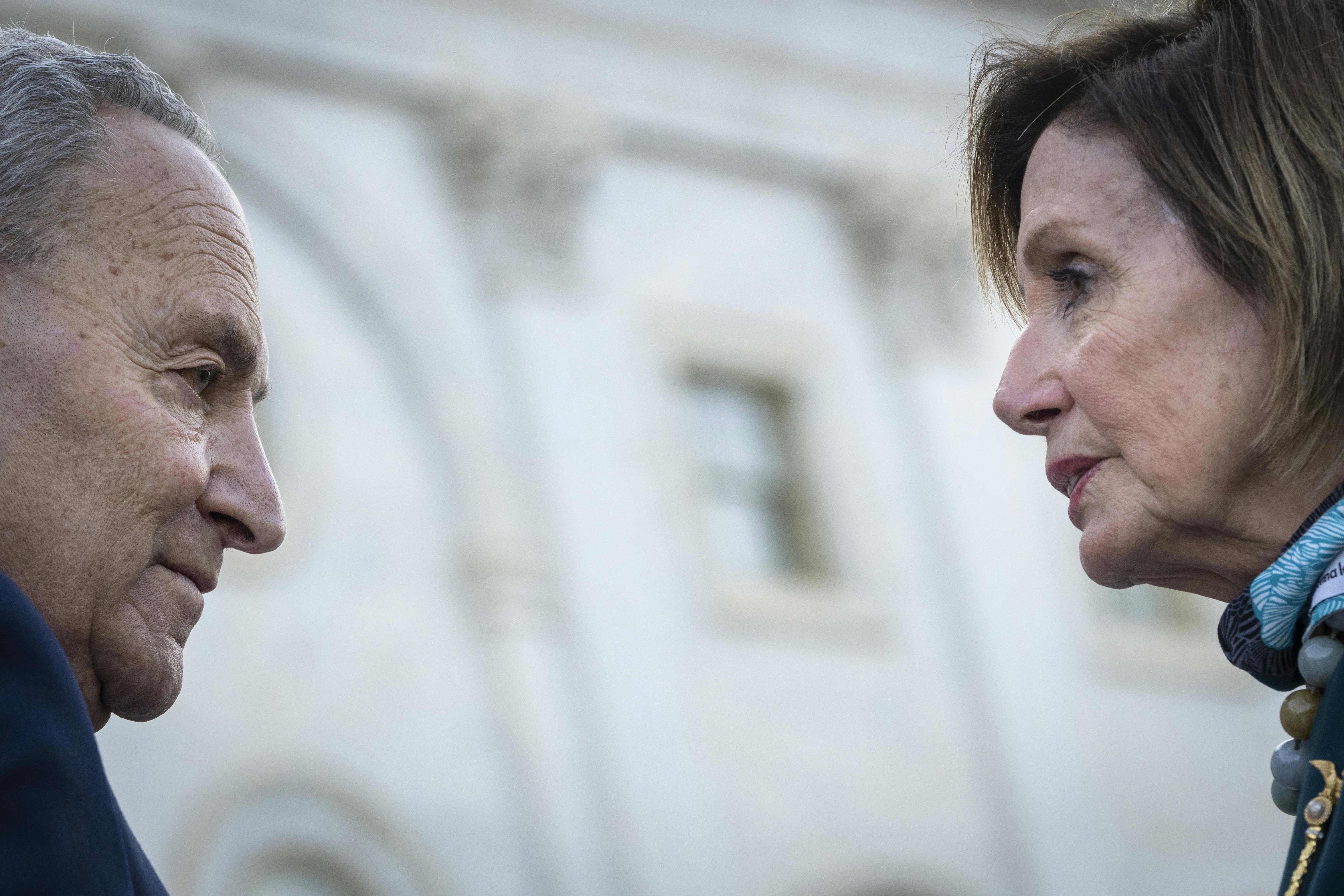 Chuck Schumer and Nancy Pelosi on the steps of the U.S. Capitol 