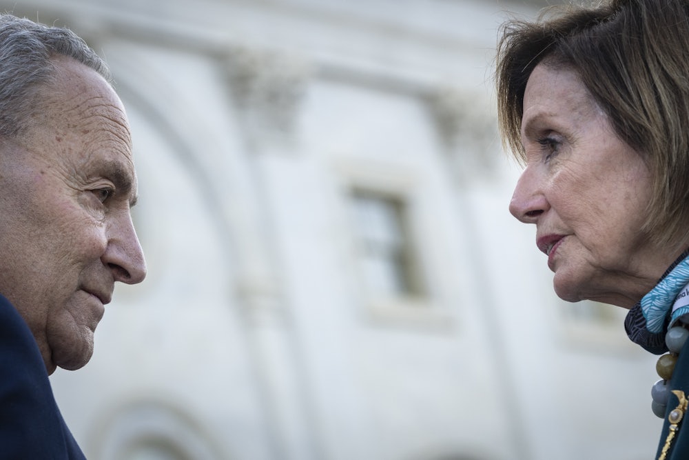 Chuck Schumer and Nancy Pelosi on the steps of the U.S. Capitol
