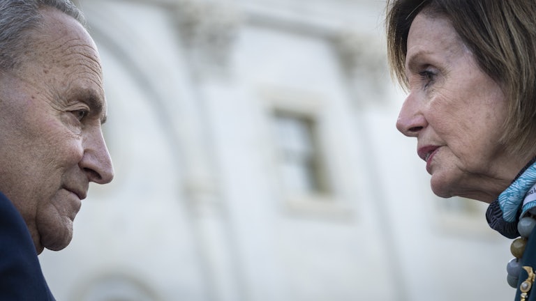 Chuck Schumer and Nancy Pelosi on the steps of the U.S. Capitol