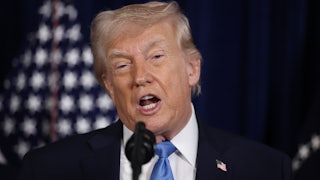 Donald Trump speaks into a microphone