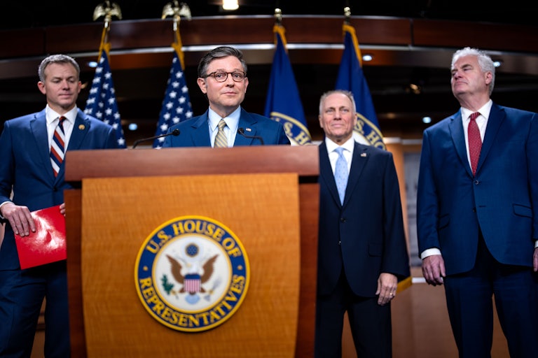 Representatives Blake Moore, Steve Scalise, and Tom Emmer stand behind Speaker Mike Johnson, who speaks at a podium