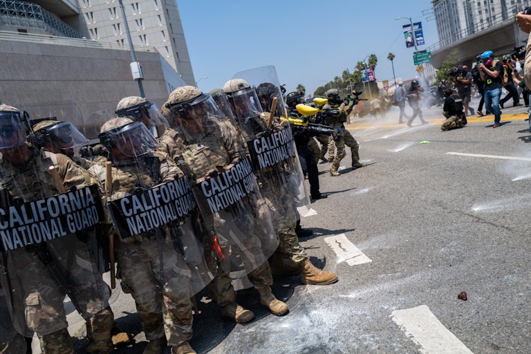 California National Guard members who were deployed to Los Angeles by Donald Trump against the wishes of the state’s governor stand in a line holding riot shields