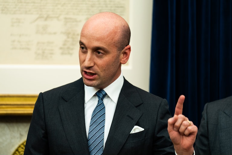 Stephen Miller raises his finger while speaking