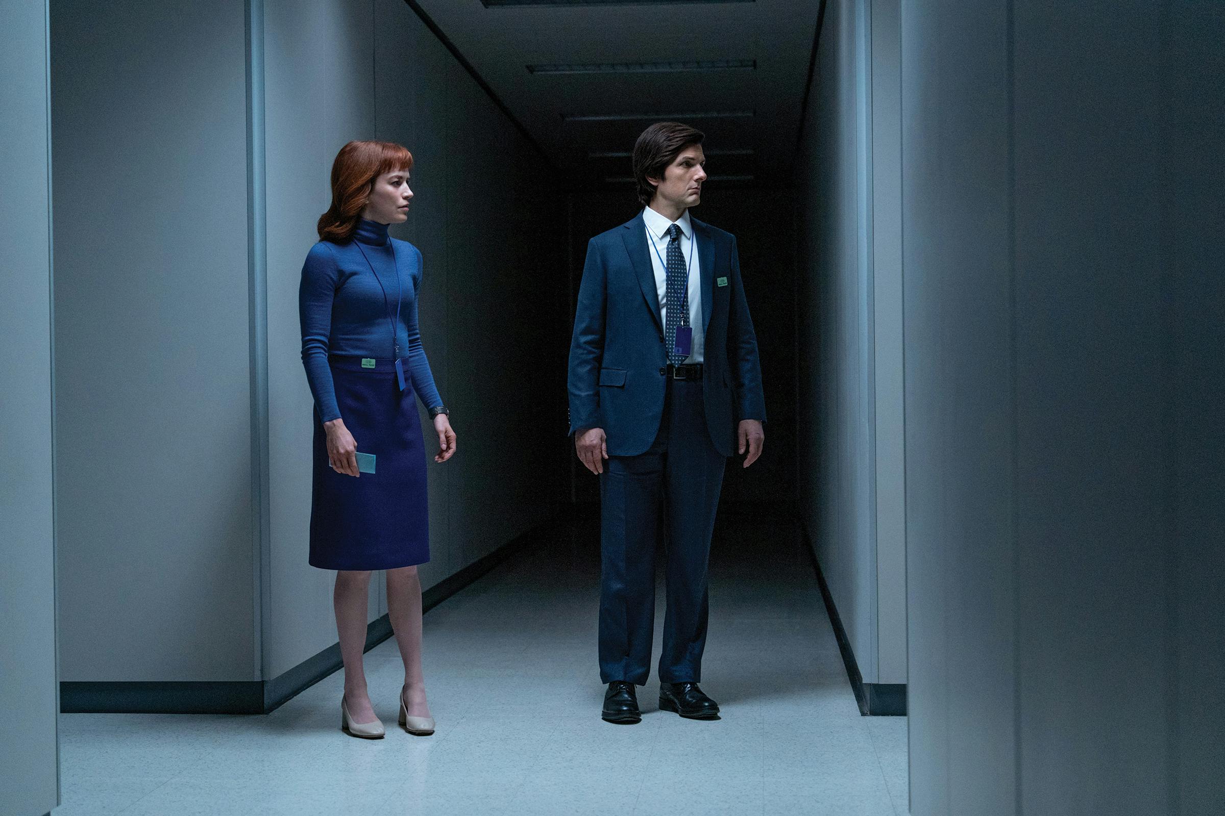 Mark S. (Adam Scott) and Helly R. (Britt Lower) stand in a hallway of the Severed floor of Lumon